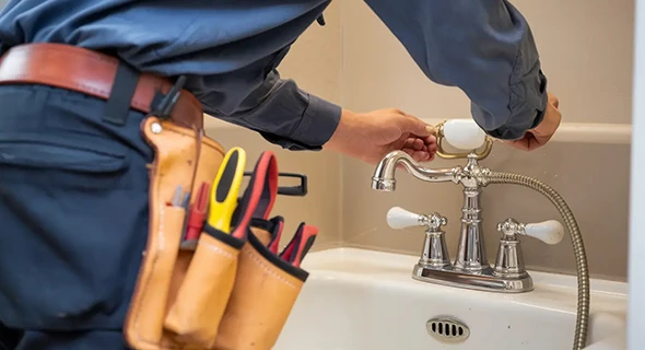 Plumber installing and inspecting plumbing in a residential property in Plantation, FL, emphasizing reliable local plumbing solutions tailored to homeowner needs.